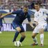 France's Benzema challenges for the ball with Iceland's Jonsson in their friendly soccer match, at Hainaut stadium in Valenciennes