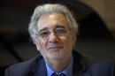 FILE - In a June 14, 2011 file photo, Spanish-born tenor Placido Domingo smiles as he answers reporters during the presentation of the 