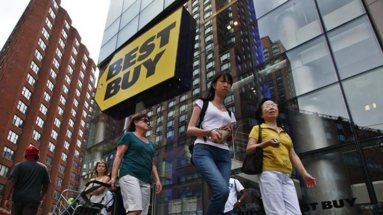 People walk past a Best Buy store in New York