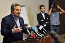Louay al-Safi, spokesman for the Syrian National Coalition, speaks during a news conference in Istanbul