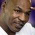 Former undisputed heavyweight boxing champion Mike Tyson points to his head during an interview at the MGM Grand Hotel and Casino in Las Vegas