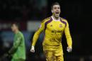 West Ham United's goalkeeper Adrian celebrates after taking and scoring a penalty kick which wins the game, following extra time and penalties during their English FA Cup third round replay soccer match between West Ham United and Everton at the Boleyn Ground stadium in London, Tuesday, Jan. 13, 2015. (AP Photo/Alastair Grant)