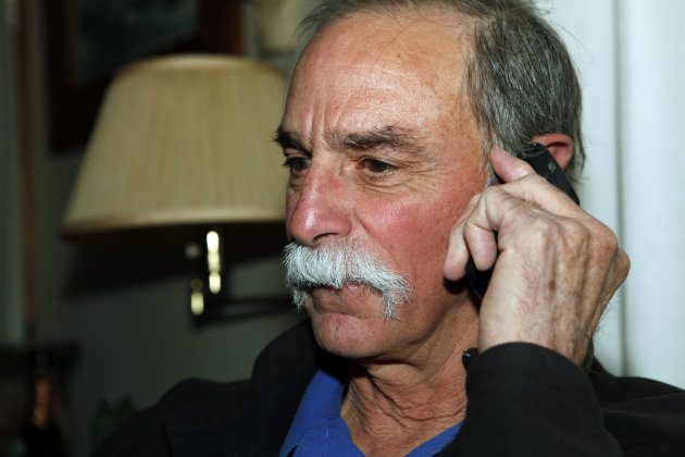 David Wineland, an American physicist at the National Institute of Standards in Boulder who shares the 2012 Nobel Prize in Physics with Serge Haroche, talks on the phone about his prize at his home in Boulder, Colo., on Tuesday, Oct. 9, 2012. (AP Photo/Ed Andrieski)