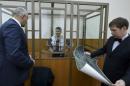 File photo of former Ukrainian army pilot Savchenko and her lawyers attending court hearing in Donetsk