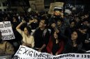 Protesters take part in a 'symbolic blockade' in front of broadcaster Televisa organized by student movement "Yo Soy 132" against Mexico's president-elect Enrique Pena Nieto in Mexico City