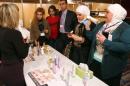 Syrian women look at beauty products on December 7, 2014, at an exhibition in Damascus where there is determination to keep up appearances despite the ugliness of the civil war