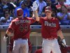 Arizona Diamondbacks' Geoff Blum, right, congratulates teammate Paul Goldschmidt after Goldschmidt's home run in the the sixth inning against the San Diego Padres in a baseball game, Sunday, Sept. 18, 2011, in San Diego. (AP Photo/Lenny Ignelzi)