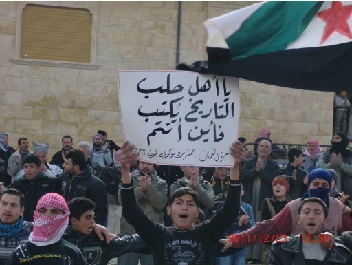 Demonstrators protest against Syria's President Bashar al-Assad after Friday prayers in Binsh near Adlb