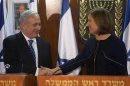 Israel's Prime Minister Benjamin Netanyahu shakes hands with former Foreign Minister Tzipi Livni during their joint statement at the Knesset in Jerusalem