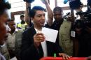Madagascar presidential candidate Andry Rajoelina gets ready to cast his vote in Antananarivo on October 25, 2013