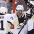 Pittsburgh Penguins' Jarome Iginla (12) is congratulated by teammates Evgeni Malkin (71) and James Neal after scoring against the Ottawa Senators during second-period NHL hockey playoff game action in Ottawa, Ontario, Wednesday, May 22, 2013. (AP Photo/The Canadian Press, Adrian Wyld)