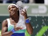 Serena Williams holds the trophy after defeating Maria Sharapova, of Russia, in the final of the Sony Open tennis tournament, Saturday, March 30, 2013, in Key Biscayne, Fla. Williams won 4-6, 6-3, 6-0. (AP Photo/Lynne Sladky)