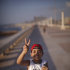 Mansur Mohamed, 9, makes the victory sign at the seaside of the rebel-held town of Benghazi, Libya, Thursday, Aug. 11, 2011. (AP Photo/Alexandre Meneghini)