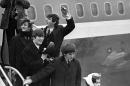 FILE - In this this Feb. 7, 1964 file photo, Britain's Beatles arrive at John F. Kennedy Airport, in New York, after their flight from London. From left to right, Ringo Starr, John Lennon, Paul McCartney and George Harrison. The Beatles would go on to take America by storm, and rock 'n' roll was never the same. (AP Photo/File)