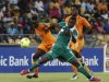 Ivory Coast's Tiote tackles Nigeria's Emenike during their African Nations Cup (AFCON 2013) quarter final soccer match in Rustenburg