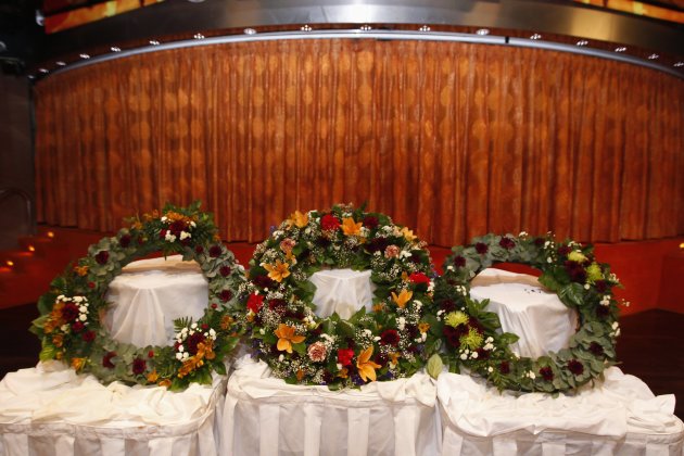 Three wreaths are seen before …