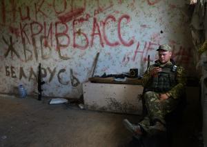 A Ukrainian serviceman rests while manning a position &hellip;