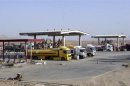Tanker trucks wait to be loaded at Taq Taq oil field in Arbil