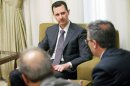 Syria's President Bashar al-Assad is seen during an interview with the al-Thawra newspaper in Damascus in this handout photograph distributed by Syria's national news agency SANA