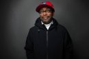 In this Jan. 23, 2012, file photo, filmmaker Spike Lee poses for a portrait during the 2012 Sundance Film Festival in Park City, Utah. An elderly couple has reached a settlement with Spike Lee after the pair said they had to leave their Florida home after the director help spread a Twitter posting listing their address as that of the man who shot an unarmed teen. The couple's attorney announced the settlement Thursday, March 29, 2012. (AP Photo/Victoria Will, File)