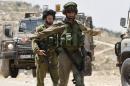 Israeli soldiers patrol the West Bank City of Hebron
