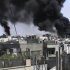 In this image made from amateur video released by the Shaam News Network and accessed Wednesday, April 18, 2012, black smoke rises from buildings in Khaldiyeh district, Homs, Syria. Nearly a week after a cease-fire took effect, Syrian troops pounded a rebel stronghold Wednesday as the country's foreign minister met with his Chinese counterpart in Beijing during the latest round of talks aimed at preventing the truce from unraveling. (AP Photo/Shaam News Network via AP video) TV OUT, THE ASSOCIATED PRESS CANNOT INDEPENDENTLY VERIFY THE CONTENT, DATE, LOCATION OR AUTHENTICITY OF THIS MATERIAL