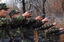 North Korean soldiers take part in a shooting drill in an unknown location