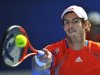 Murray of Britain hits a return to Nishikori of Japan during their quarter-final match at the Australian Open in Melbourne
