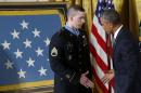 U.S. President Obama congratulates Medal of Honor recipient U.S. Army Staff Sgt. Pitts in the East Room of the White House in Washington