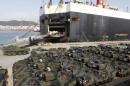 Vehicles of the U.S. Army, are unloaded from MV Green Ridge at Pier 8 in Busan