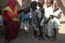A file photo taken on November 18, 2007 shows a social worker giving polio drops to children in Madani, in east-central Sudan