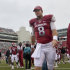 In this photo taken Sept. 15, 2012, Arkansas quarterback Tyler Wilson (8) walks from the field after Arkansas' 52-0 loss to Alabama in an NCAA college football game in Fayetteville, Ark. Wilson could not play in the game because of a head injury suffered against Louisiana-Monroe on Sept. 8, and will not play until cleared by doctors to return. (AP Photo/Danny Johnston)