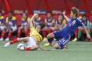 Ecuador's Mayra Olivera (5) and Japan's Asuna Tanaka (14) vie for the ball during the first half of a FIFA Women's World Cup soccer game in Winnipeg, Manitoba, Canada, on Tuesday, June 16, 2015. (John Woods/The Canadian Press via AP)