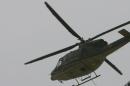 A helicopter flies in Accra on March 6, 2007