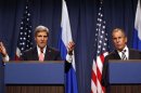 John Kerry (L) speaks during a press conference with Sergei Lavrov in Geneva on September 14,2013