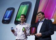 FILE - In this Feb. 9, 2011 file photo, Todd Bradley, right, Hewlett Packard Executive Vice President Personal Systems Group, right, and Jon Rubinstein, left, Palm Senior Vice President and General Manager, hold, from left, a Palm Veer, a Palm Pre 3, and an HP TouchPad during a Palm and Hewlett Packard announcement in San Francisco. In a dramatic reshuffling, Hewlett-Packard Co. on Thursday, Aug. 18, 2011 said that it will discontinue its tablet computer and smartphone products and may sell or spin off its PC division, bowing out of the consumer businesses. The announcement comes just two years after spending $1.8 billion on smartphone maker Palm, which gave HP the webOS software that has been praised by critics but largely been ignored by the marketplace. (AP Photo/Paul Sakuma, File)