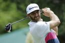 Dustin Johnson watches his tee shot on the 15th hole during the first round of the Memorial golf tournament, Thursday, June 2, 2016, in Dublin, Ohio. (AP Photo/Darron Cummings)