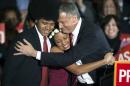 Democratic mayor-elect of New York, Bill de Blasio, hugs his daughter Chiara and son Dante during his election victory party at the Park Slope Armory in New York in this file photo