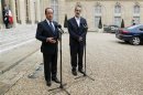 France's President Hollande and the new Syrian National Coalition head al-Khatib speak to journalists following a meeting at the Elysee Palace in Paris