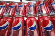 <p>               This Feb. 7, 2012 photo, shows cans Diet Pepsi Wild Cherry at a store in Pittsburgh. PepsiCo said Thursday, Feb. 9, 2012, it will cut 8.700 jobs in a cost-cutting move as it increases investment in advertising and marketing in North America. (AP Photo/Gene J. Puskar)