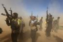 Iraqi fighters of the government-controlled Popular Mobilisation units gather on the western entrance of the Iraqi city of Tikrit