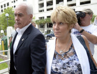 George Anthony, left, and Cindy Anthony, parents of Casey Anthony, arrive at the Orange County Courthouse for Casey Anthony's sentencing in Orlando, Fla., Thursday, July 7, 2011. Anthony was acquitted of murder charges. (AP Photo/Phelan M. Ebenhack)