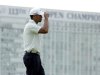 Tiger Woods reacts after putting on the 18th hole during the third round of the U.S. Open golf tournament at Merion Golf Club, Saturday, June 15, 2013, in Ardmore, Pa. (AP Photo/Charlie Riedel)