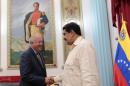 Venezuela's President Nicolas Maduro (R) shakes hands with U.S. diplomat Thomas Shannon in Caracas