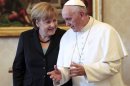 Pope Francis meets with German Chancellor Angela Merkel during a private audience at the Vatican, Saturday, May 18, 2013. (AP Photo/Gregorio Borgia, Pool)