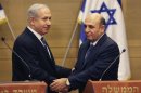 Israel's Prime Minister Benjamin Netanyahu, left, and Kadima party leader Shaul Mofaz shake hands before holding a joint press conference announcing the new coalition government, in Jerusalem, Tuesday, May 8, 2012. Netanyahu said Tuesday his new coalition government will promote a 