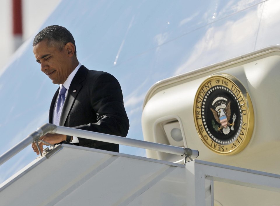 US President Barack Obama during his arrival at Pulkovo International Airport on Air Force One, Thursday, Sept. 5, 2013, in St. Petersburg, Russia. Obama traveled to Russia to attend the G20 Summit. (AP Photo/Pablo Martinez Monsivais)