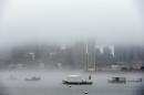 Fog shrouds Boston Harbor and obscures the skyline, Monday, Jan. 6, 2014, in Boston. After a severe winter storm on Friday and days of freezing temperatures in the Boston area, rain was in the forecast for Monday with temperatures reaching into the 50s. (AP Photo/Michael Dwyer)
