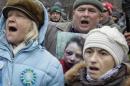 Protester holds a picture of journalist Chornovil, during protest rally in front of Ukrainian Ministry of Internal Affairs in Kiev
