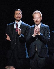 Actor Brad Pitt, left, and actor Jesse Tyler Ferguson clap during the curtain call at the Los Angeles premiere of the play "8" in Los Angeles on Saturday, March 3, 2012. (AP Photo/Dan Steinberg)